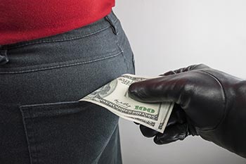 Thief robbing dollars